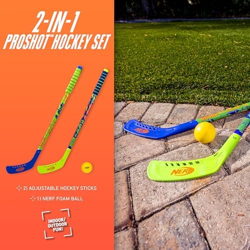 Two youth players practicing floor hockey indoors with adjustable blue and yellow NERF hockey sticks.