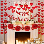 Close up view of the shimmering red PVC hanging heart swirls suspended gracefully from a white room ceiling.