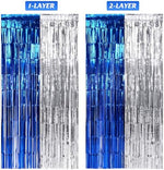 Shining blue and silver metallic streamers background close up view