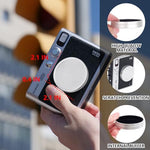 WOGOZAN sixty-four pocket polyurethane leather mini photo album filled with three-inch instant prints.