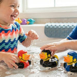 Assorted sport themed two inch rubber ducks in red blue and black hockey jerseys.