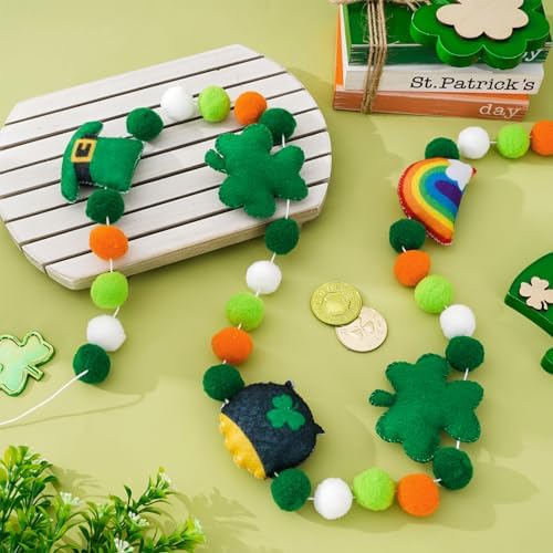 Close up of the colorful rainbow and pot of gold felt shapes on the string