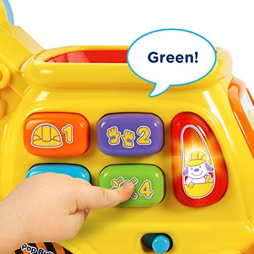 Interactive bulldozer toy showing the front scoop bucket containing the multicolored plastic balls