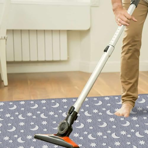 Eanpet glow in the dark star area rug illuminating in a dark bedroom