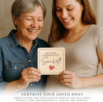 First time grandparents gift package opening to reveal the wooden sonogram photo frame inside.