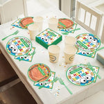 Close up of vibrant cartoon brick wall design on disposable party plates