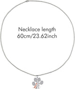 Pet dog showing the matching collar necklace pendant variant during a walk.
