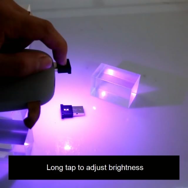 AOZITA car atmosphere decoration light showing the single button control mechanism on the top side.