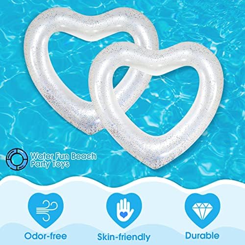 Two white heart shaped swimming rings for adults