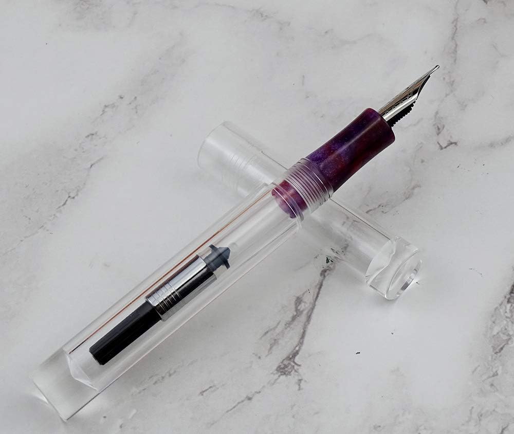 Marbled celluloid grip section on clear acrylic pocket pen