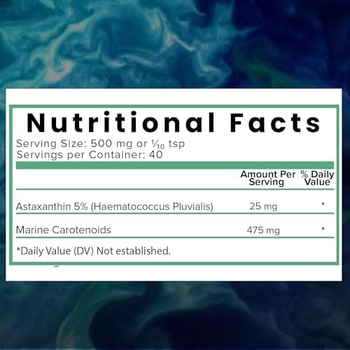 Vibrant red organic astaxanthin powder scooped out of packaging
