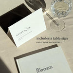Elegant wedding guest book placed on a reception table
