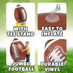 Giant blow up football toy resting on its stable kicking tee in a backyard.