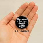 Black activist quote button attached to a jacket fabric background