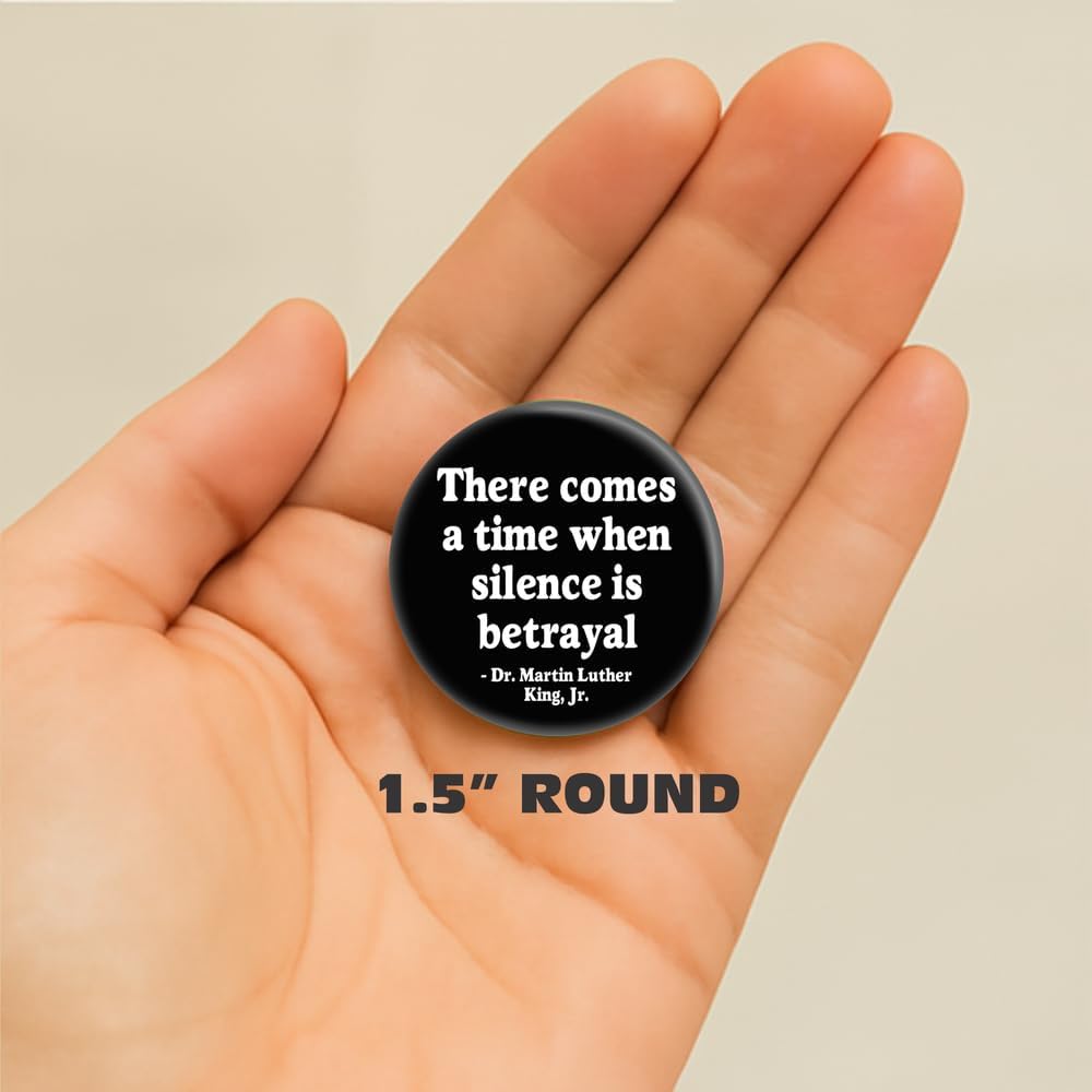 Black activist quote button attached to a jacket fabric background