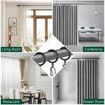 Water resistant Dpyrrhic black metal rings supporting a heavy luxury shower curtain panel in a modern bathroom setup.