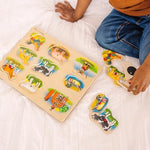 Child playing with Melissa & Doug farm animal sound puzzle