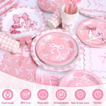 Pink bow themed banner and balloon decorations