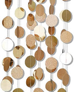 Six pieces of gold circle dot garland used as a wedding photo booth backdrop