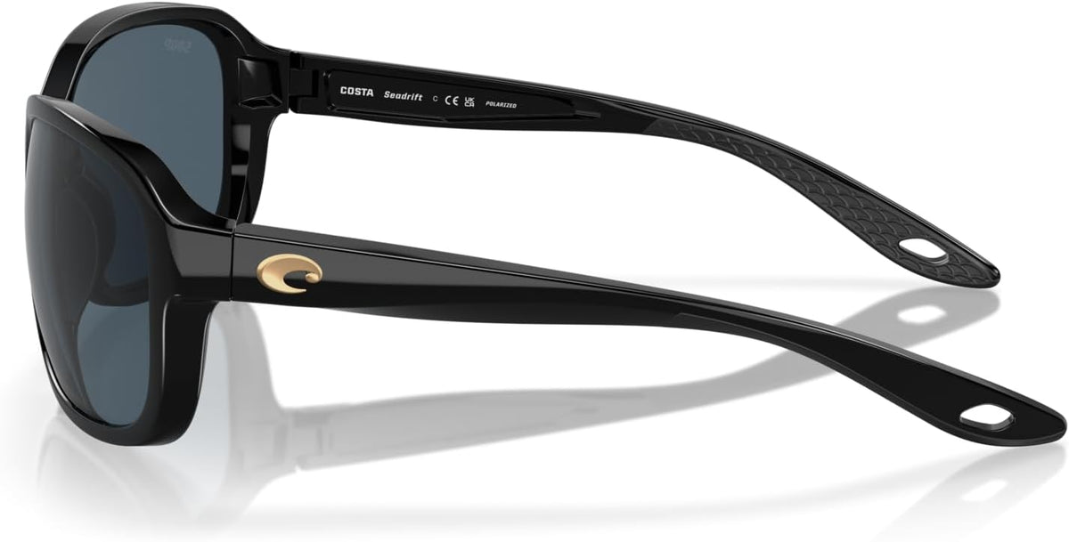 Costa Del Mar polarized sunglasses resting on flat surface