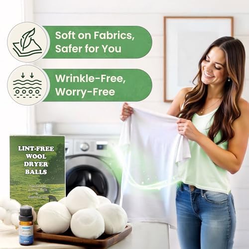 Six extra large white wool dryer balls with stretch velvet covers and baseball stitching arranged next to storage bag