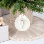 Finished Reece Studio baby first Christmas clay ornament hanging beautifully as a festive decoration.