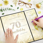 Table setting display with 70th birthday signature board