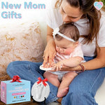 Heart shaped clay ornament with baby footprint hanging from a blue satin ribbon