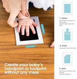 Detailed newborn footprint comparison on premium white keepsake paper.