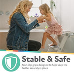 Nuby all-in-one step ladder potty seat topper positioned on a standard bathroom toilet bowl for toddlers