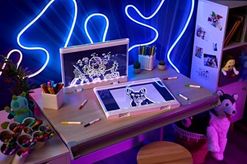Wiping the reusable acrylic surface of the Crayola ultimate light board clean with a damp cloth.