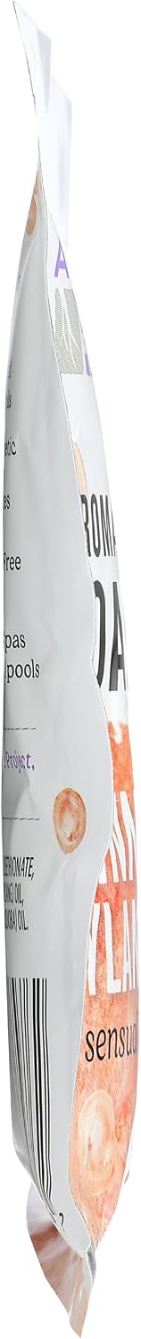 Aura Cacia natural foam bath packet resting on spa setting