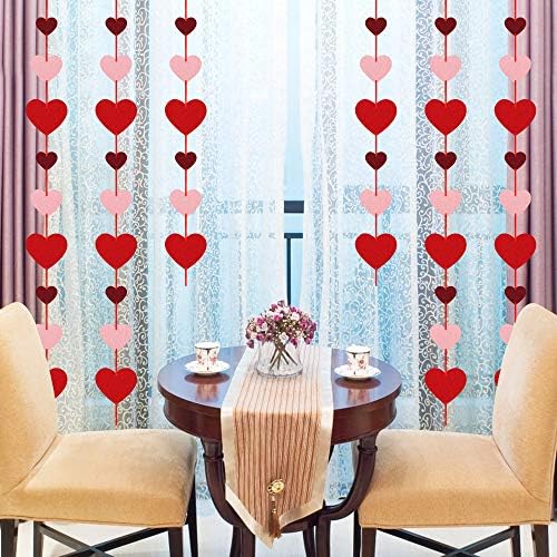 Folded reusable Auihiay felt heart garlands demonstrating easy storage after a party celebration