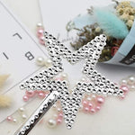 Detailed view of silver star wand top design