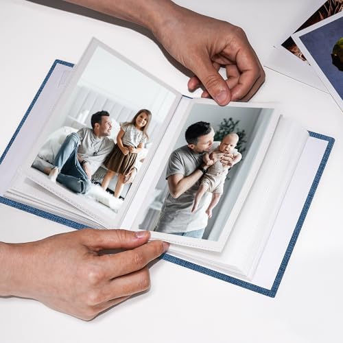 Vienrose small pocket album being placed into a travel bag as a portable brag book.