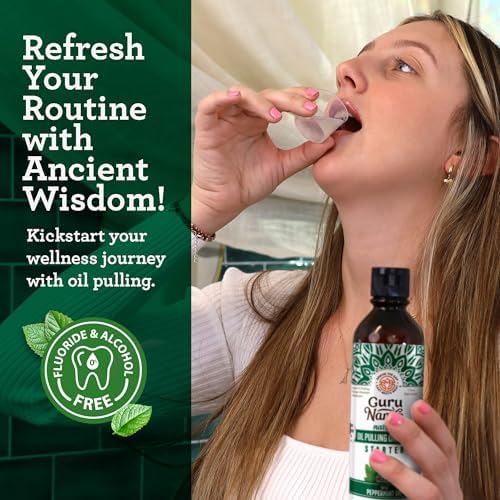 Close up of the GuruNanda fractionated coconut and peppermint oil mouthwash pouring into the measuring cap.