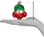 Old World Christmas fruit collection glass ornament hanging on a Christmas tree