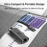 Uni portable Type-C network accessory next to a smartphone demonstrating its travel-friendly size