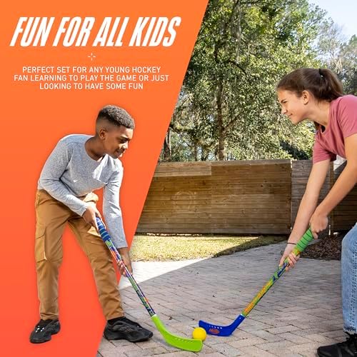 Kids playing outdoor driveway hockey with the weather resistant Franklin Sports youth sticks set.