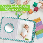 GPIRAL soft cloth baby book opened to reveal clear pockets holding four by six photos.