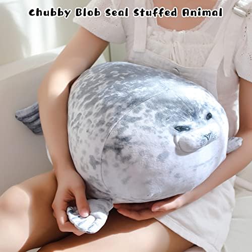 TOYSYM 20 inch giant seal plush toy displayed as a cute decorative accent on a neatly made kids bed.