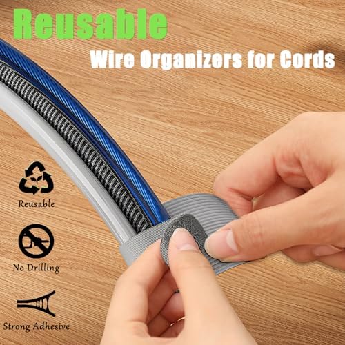 Self adhesive reusable cord organizers applied under a desk to neatly bundle computer and monitor power wires.