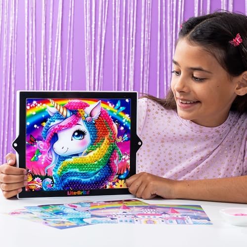 Lite-Brite Rainbow Dreams creative toy setup with colorful mini pegs inserted into a fairy template.