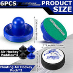 Four black and blue air hockey strikers with felt bottoms and two hover pucks