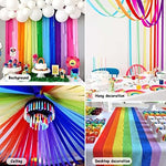 Bright pastel and primary colored paper streamers draped from a ceiling to create a tent effect.