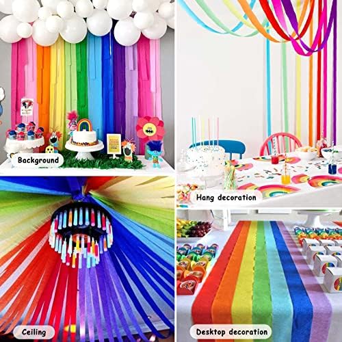 Bright pastel and primary colored paper streamers draped from a ceiling to create a tent effect.