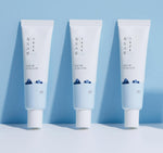 Korean skincare Round Lab Dokdo eye treatment tube held showing product size details