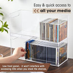 Top down view of clear acrylic storage box containing organized media cases and a removable insert.