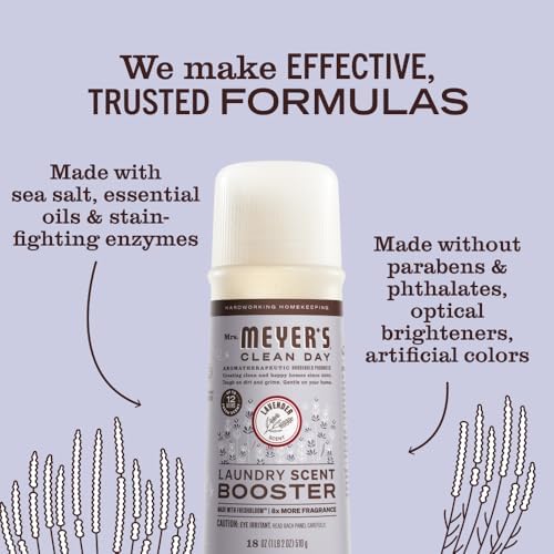 Mrs. Meyer's plant-based laundry scent booster bottle displayed next to fresh lavender flowers indicating its natural scent profile.