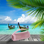 Rear view of the JCHPINE travel holder illustrating how it seamlessly wraps around a portable Bluetooth speaker.